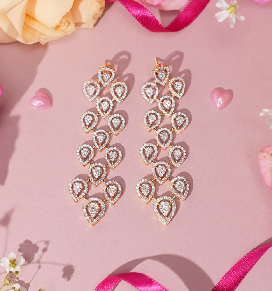 Long diamond drop earrings in gold with multiple teardrop design for women